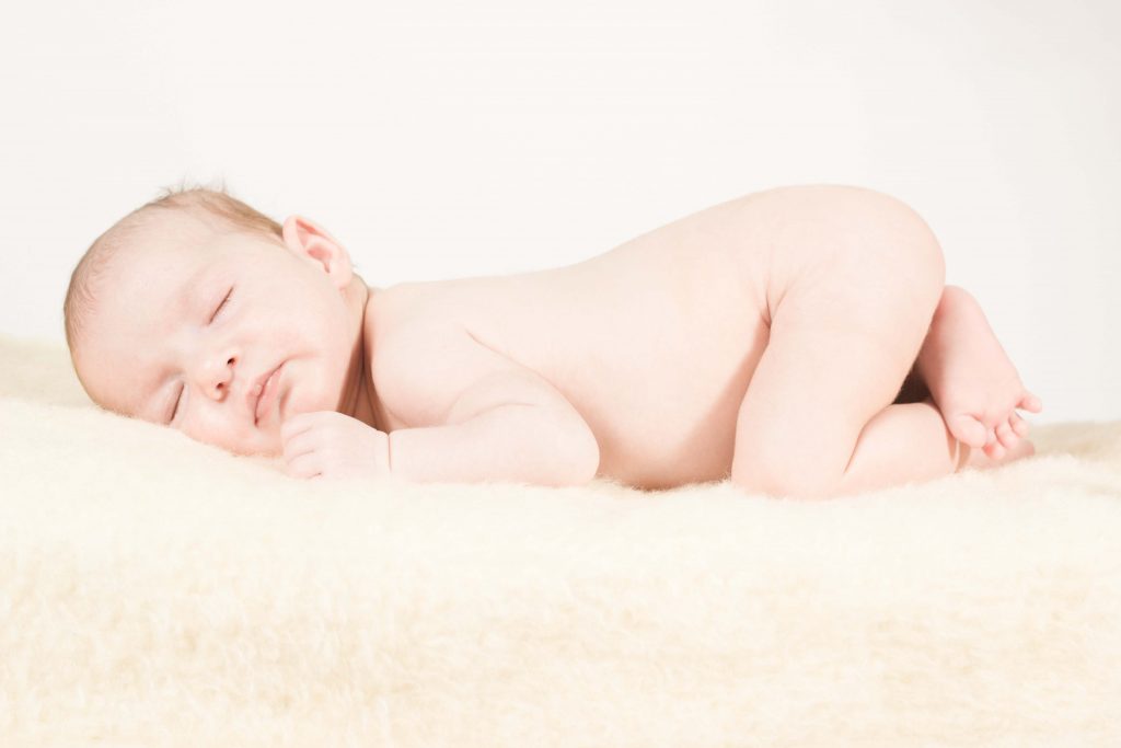 A child sleeping, as his mother adopts these proven ways for child sleep